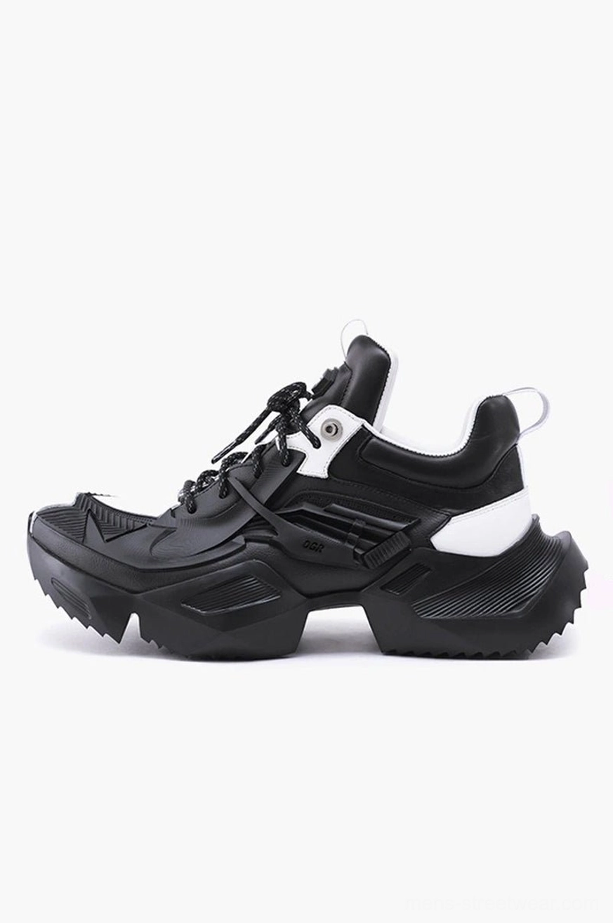 Rear three-quarter view of tactical platform sneakers with black artificial leather upper, white heel accent, and rugged serrated outdoor outsole