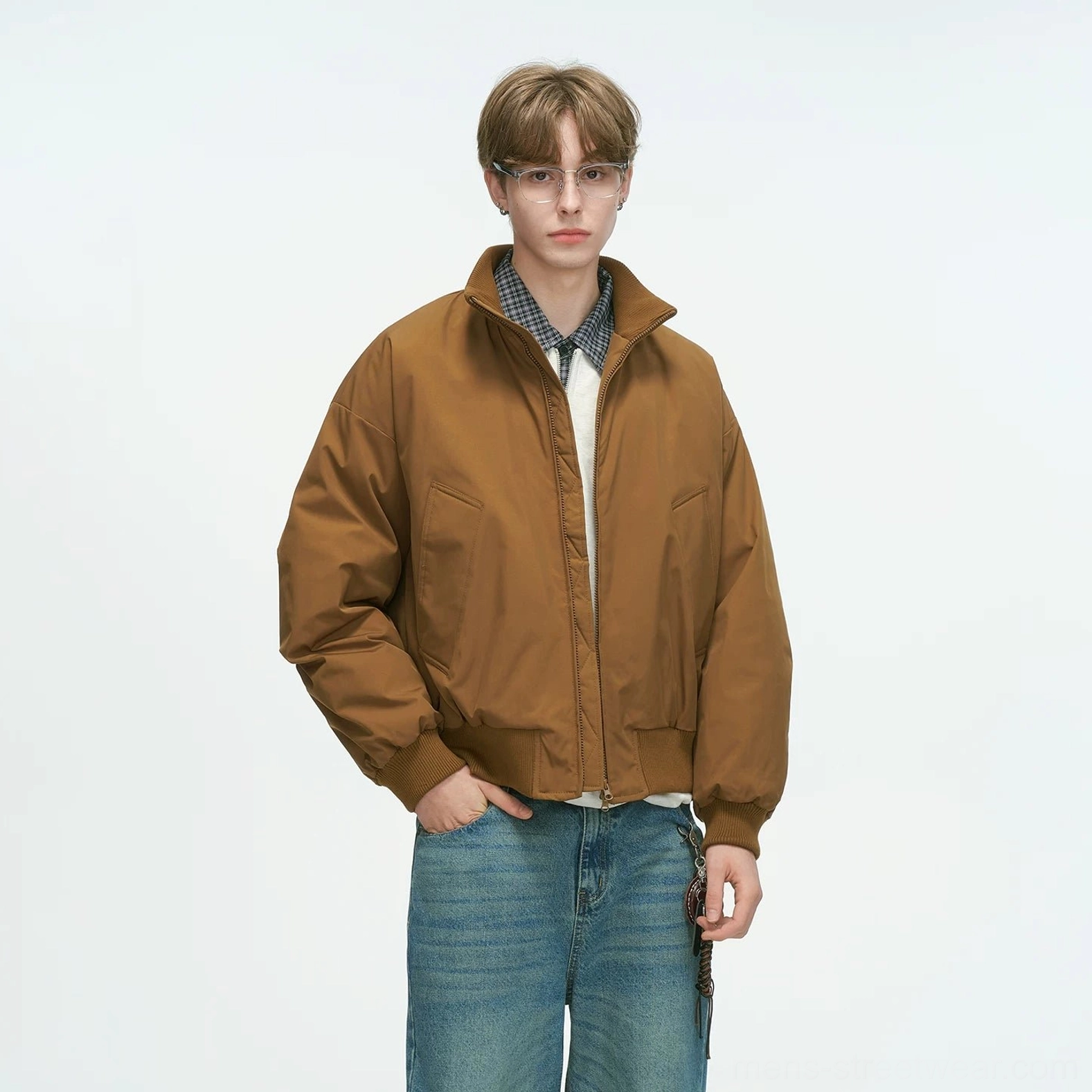 Tan brown bomber jacket standalone display shot showing relaxed drop-shoulder silhouette, stand collar and slanted welt pockets streetwear design