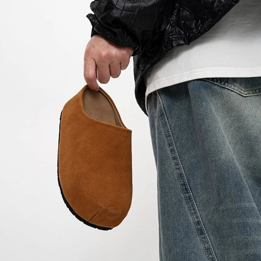 Tan brown suede clog shown from the front side with visible toe seam detail and a chunky minimalist platform sole