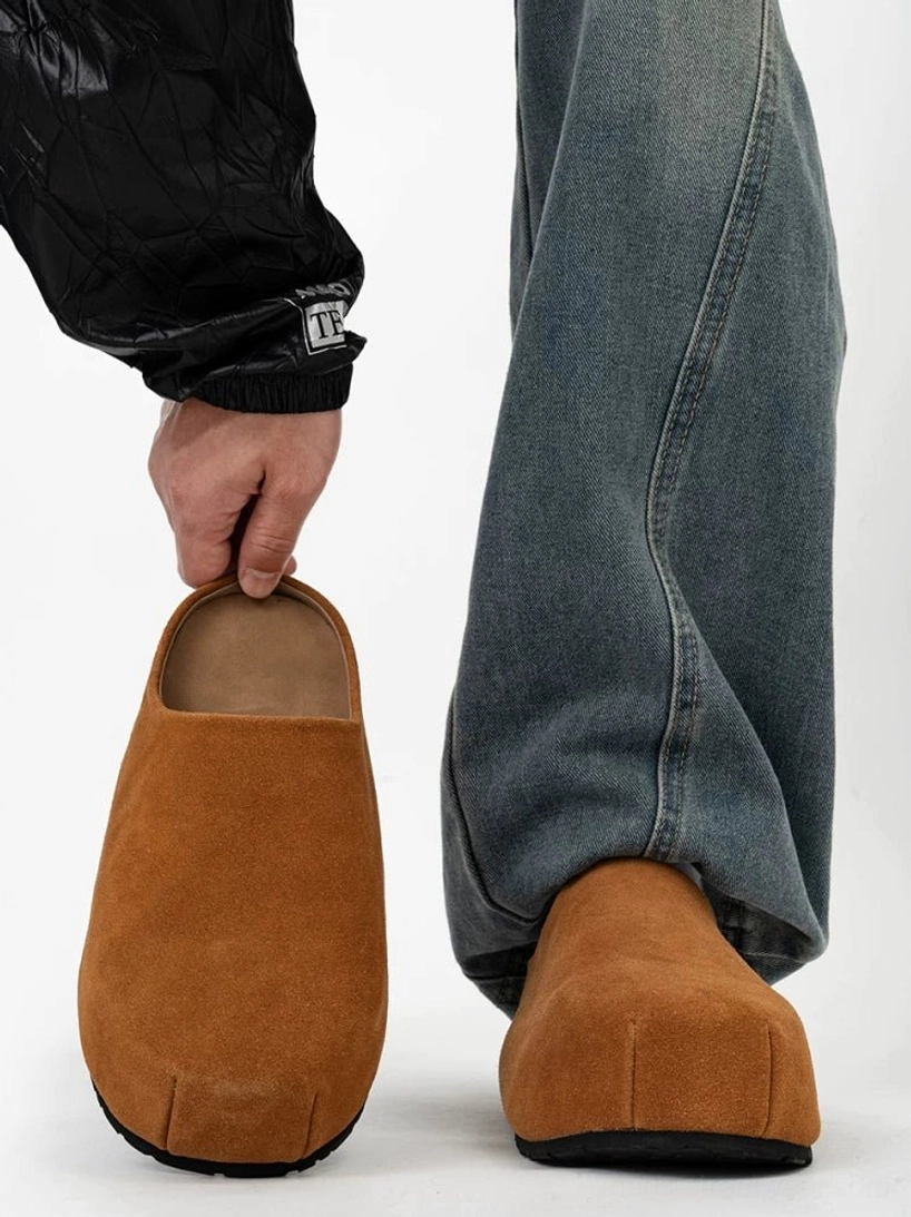 Tan brown suede slip-on platform clog shown from the side and rear with a rounded closed toe and clean mule silhouette