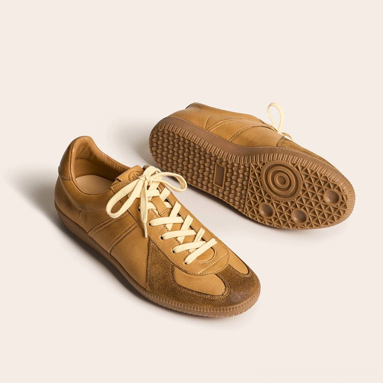 Tan brown vintage leather German Army Trainer sneakers with gum outsole and circular grip zones