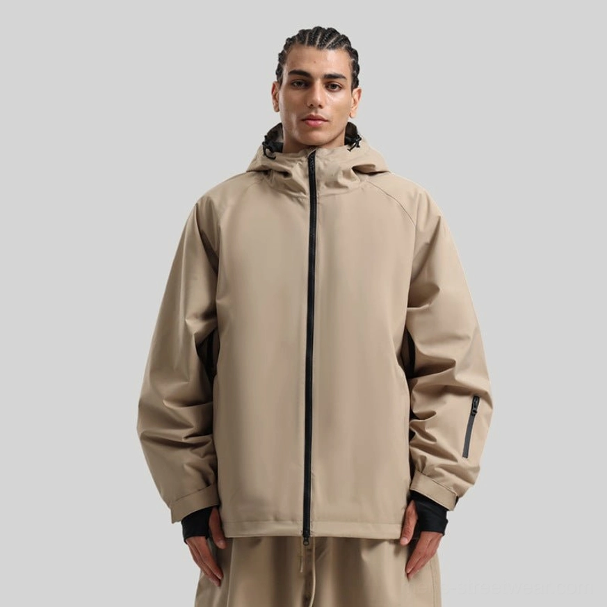Tan hooded outdoor snowboard jacket shown from the front, featuring a relaxed fit, zippered closure, and modern gorpcore styling