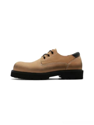 Tan full-grain leather lug-sole derby shoes shown from the side with black laces, contrast stitching, and rugged rubber outsole