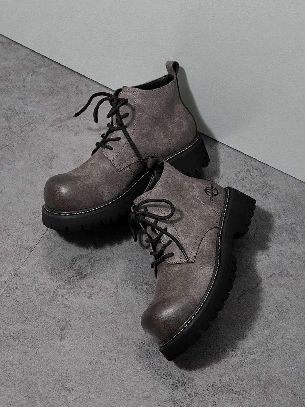 Tan lug-sole boots with clean utility profile and relaxed silhouette for Seoul-inspired outfits