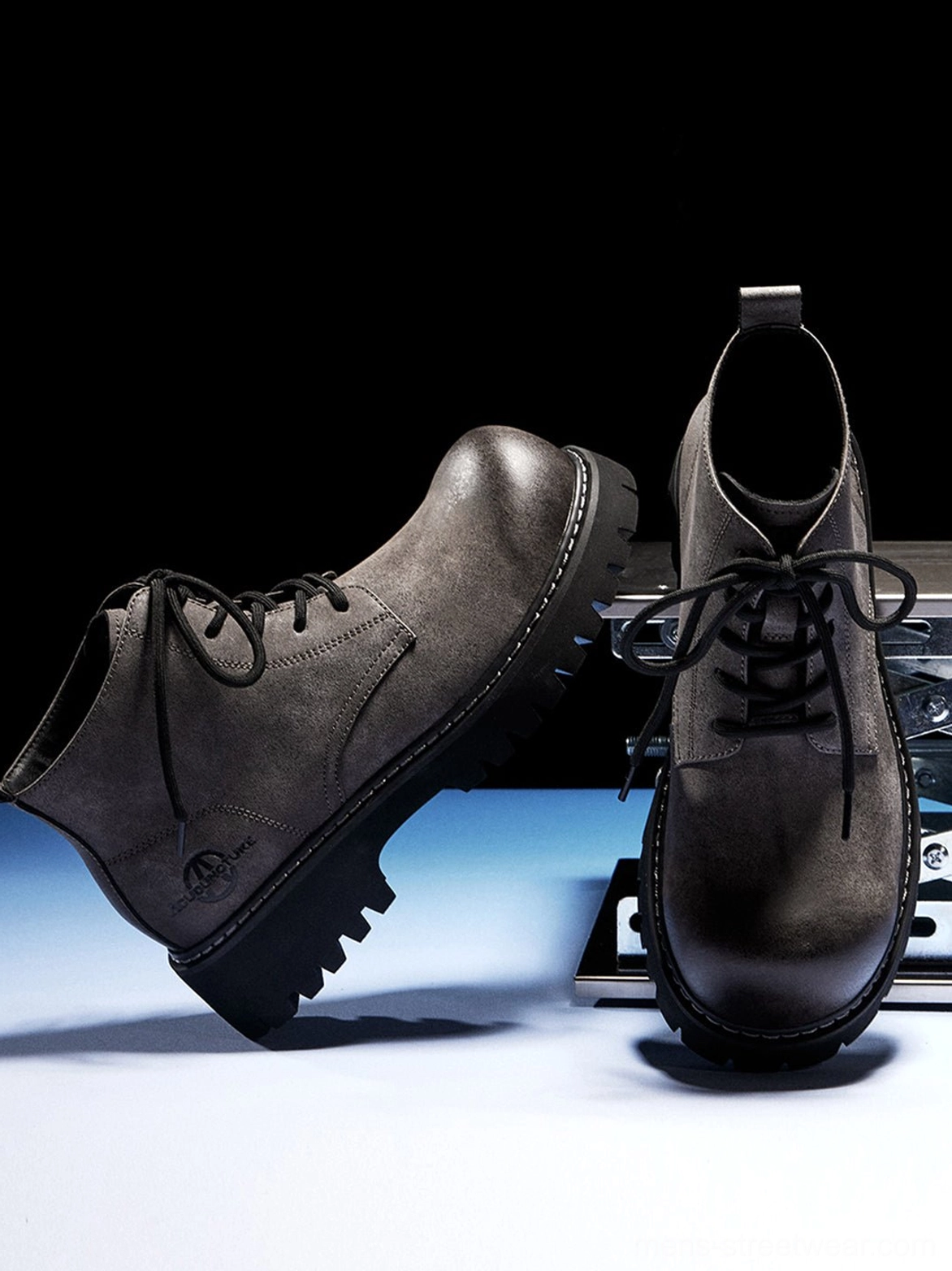 Tan round-toe lace-up boots with rugged outsole for contemporary workwear and urban fashion