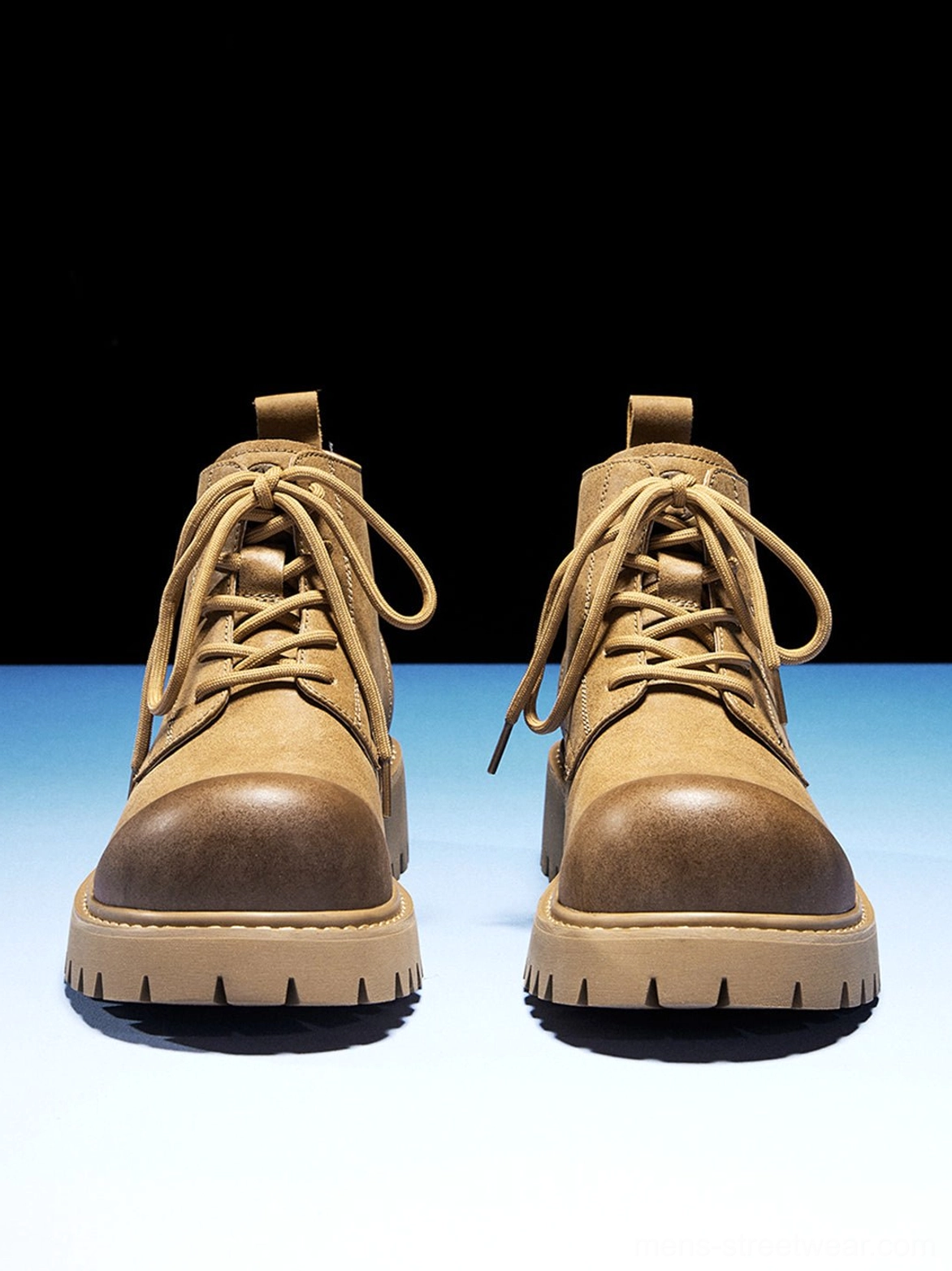 Front view of matching tan round-toe lace-up work boots with chunky deep lug soles