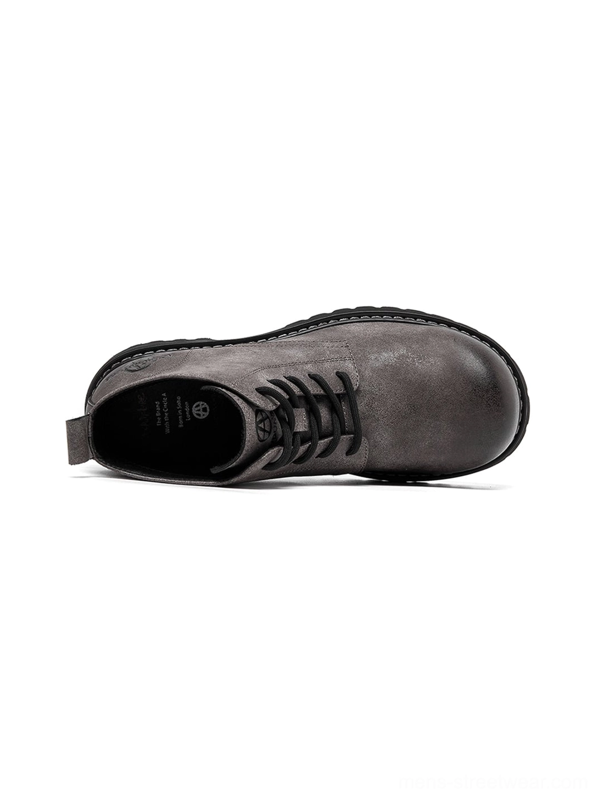 Tan round-toe lug boots styled for oversized silhouettes, relaxed denim, and contemporary streetwear