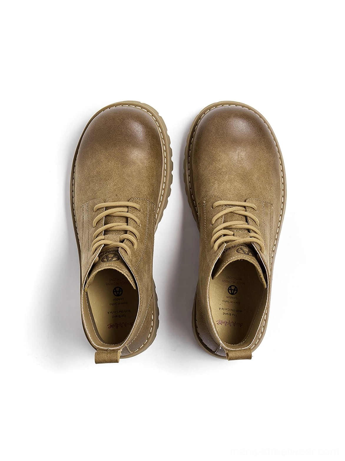 Close product view of tan round-toe work boots highlighting laces, padded collar, and rugged outsole