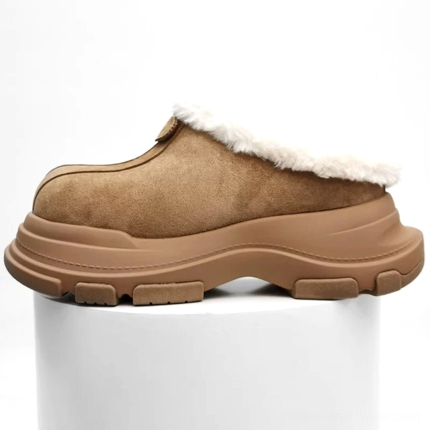 Tan suede winter platform clog displayed on a white pedestal with faux-fur collar, thick rubber sole, and decorative heel strap