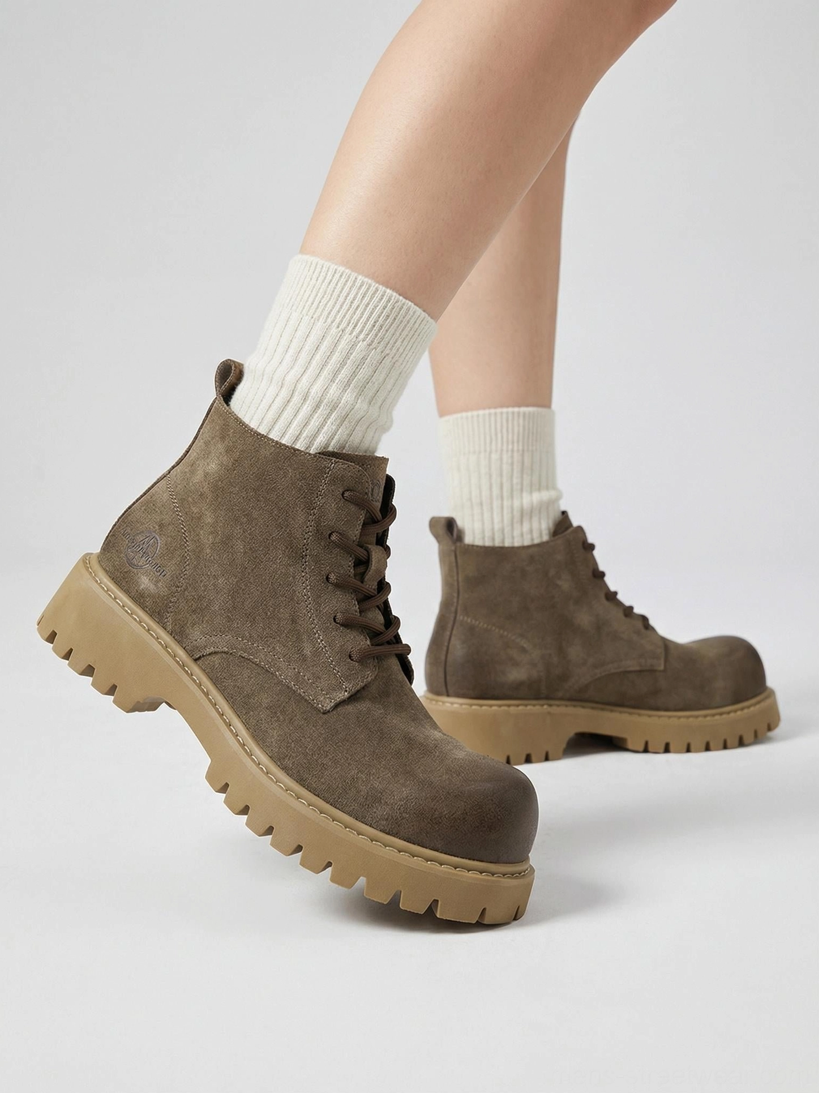 Tan synthetic leather ankle work boots with chunky sole suited to gorpcore and Korean streetwear looks
