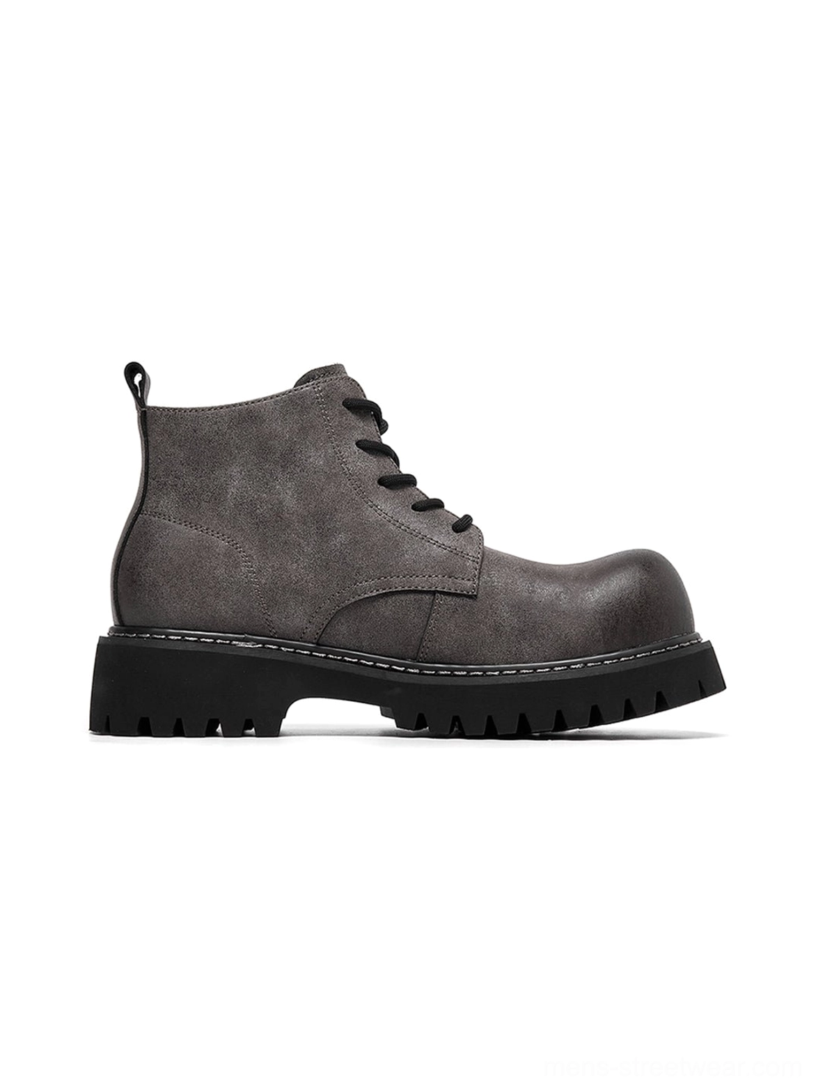 Tan synthetic leather work boots with upturned toe and rugged profile for utility-inspired fashion