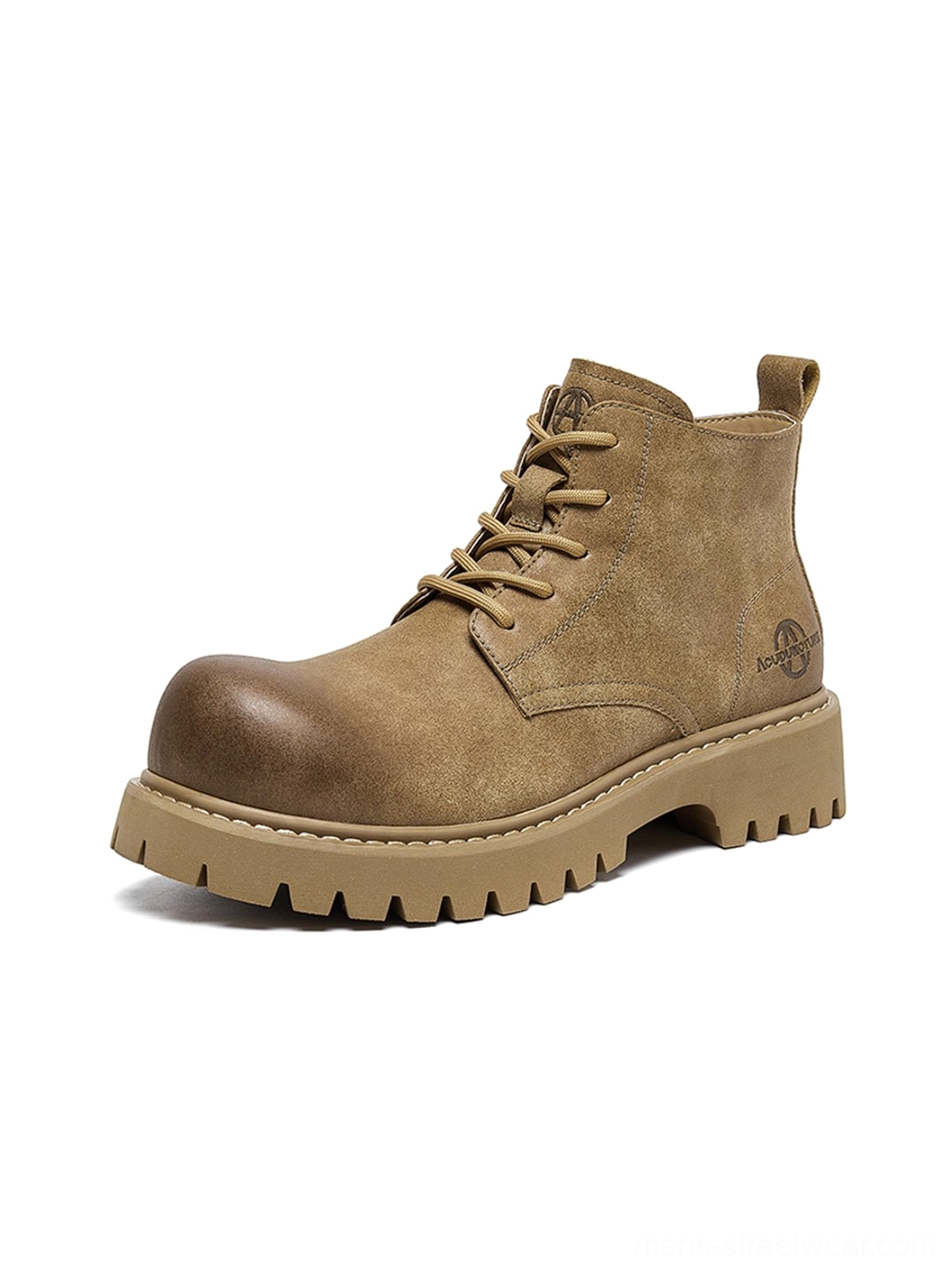 Tan work boots with bold round toe and chunky lug sole styled as contemporary urban utility footwear
