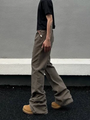 Side walking view of camel taupe washed straight-leg denim jeans with relaxed drape and long stacked hem