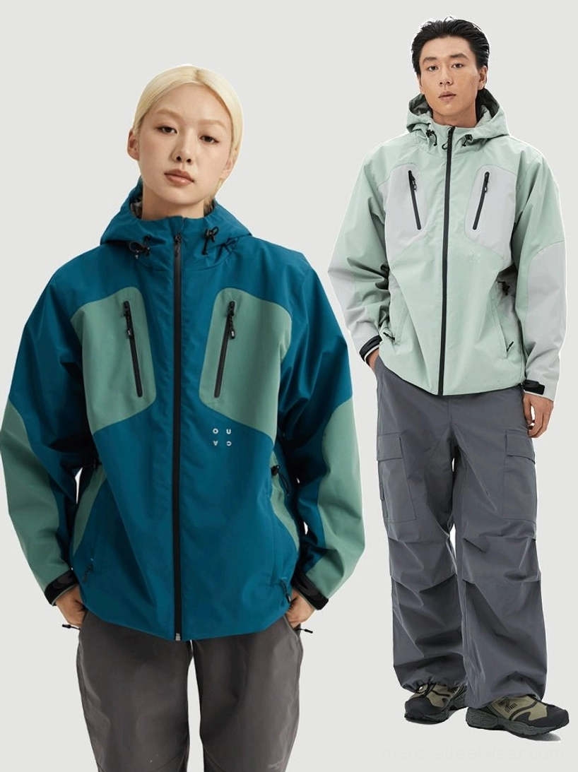 Two color-block hooded streetwear jackets in teal and mint green modeled to show the relaxed fit and adjustable hems
