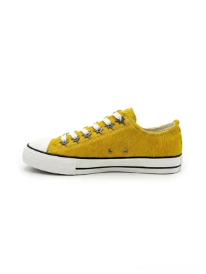 Mustard yellow textured cowhide low-profile sneakers with white rubber toe cap and black contrast side stripe side view