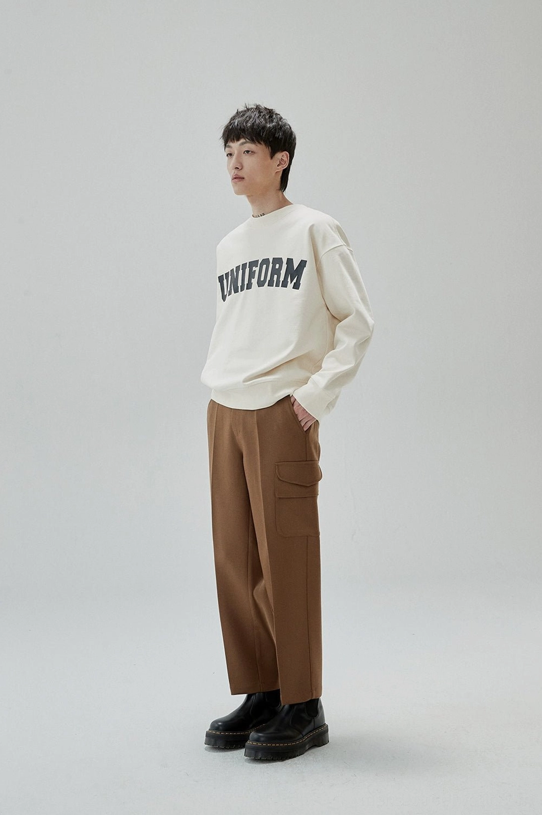 Textured rubber print UNIFORM sweatshirt combining retro sportswear and modern street fashion