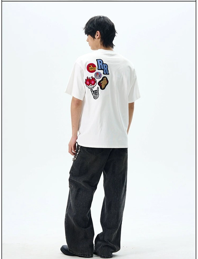 Rear view of white THE DOODS graphic patch streetwear T-shirt with skull and RR embroidered back artwork