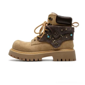 Tan turquoise studded streetwear ankle boots with decorative canvas panel, metal hardware and chunky lug sole side view