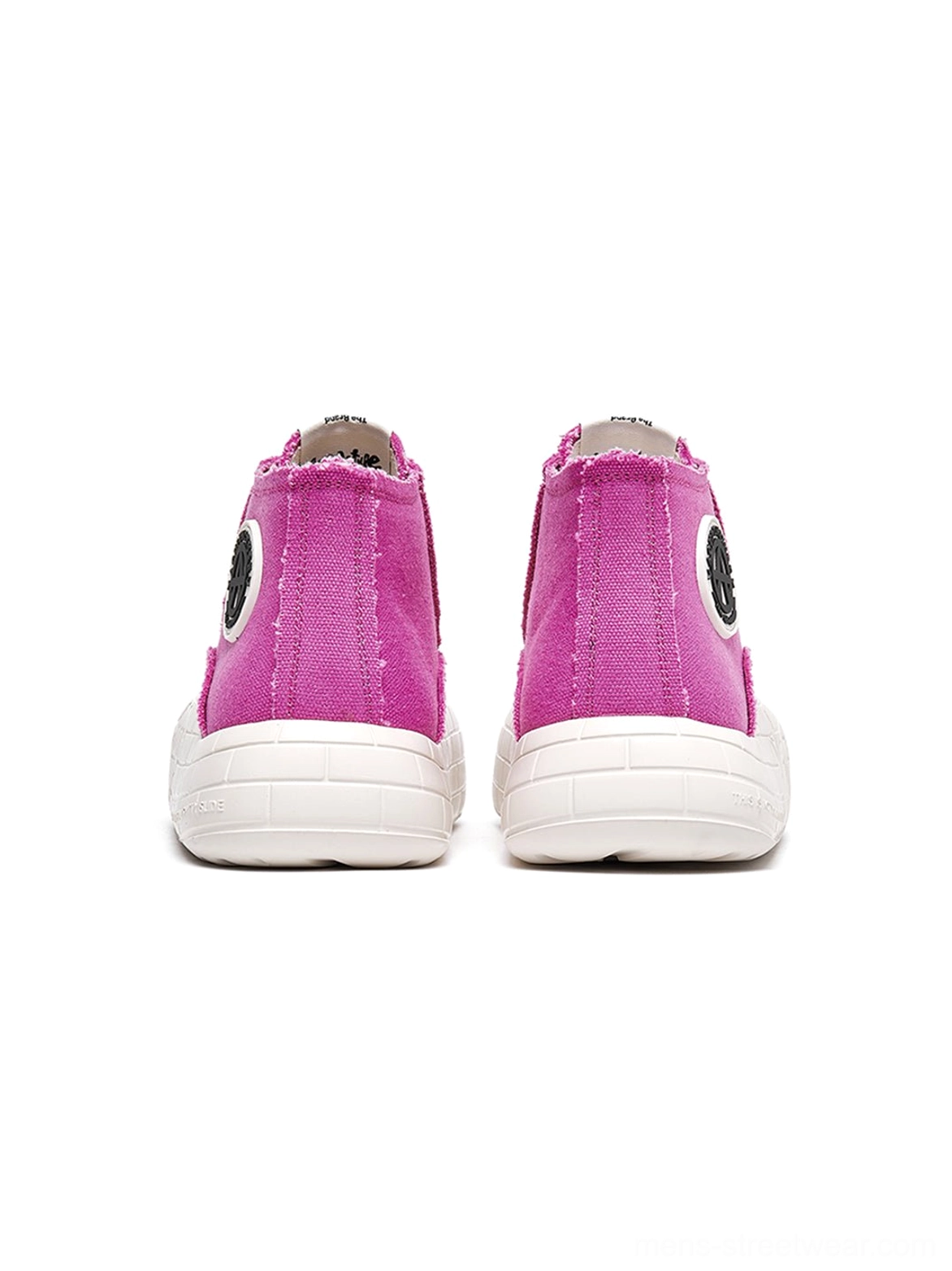 Canvas streetwear sneakers with an ankle-height shaft, extended lacing, and oversized platform sole