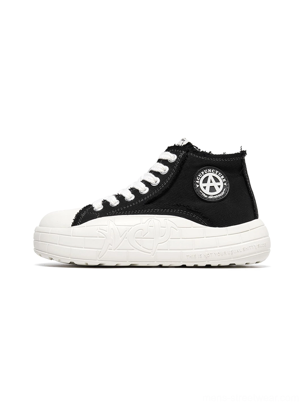 Black and white two-tone canvas high-top platform sneakers with white toe cap, thick sole, side badge, and frayed ankle collar