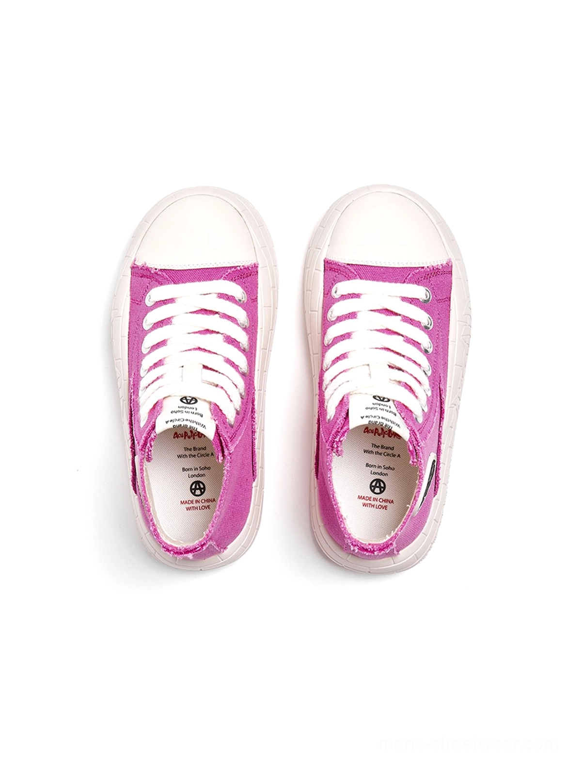 High-top platform sneakers featuring contrast canvas panels, rounded toe, and a bold everyday profile
