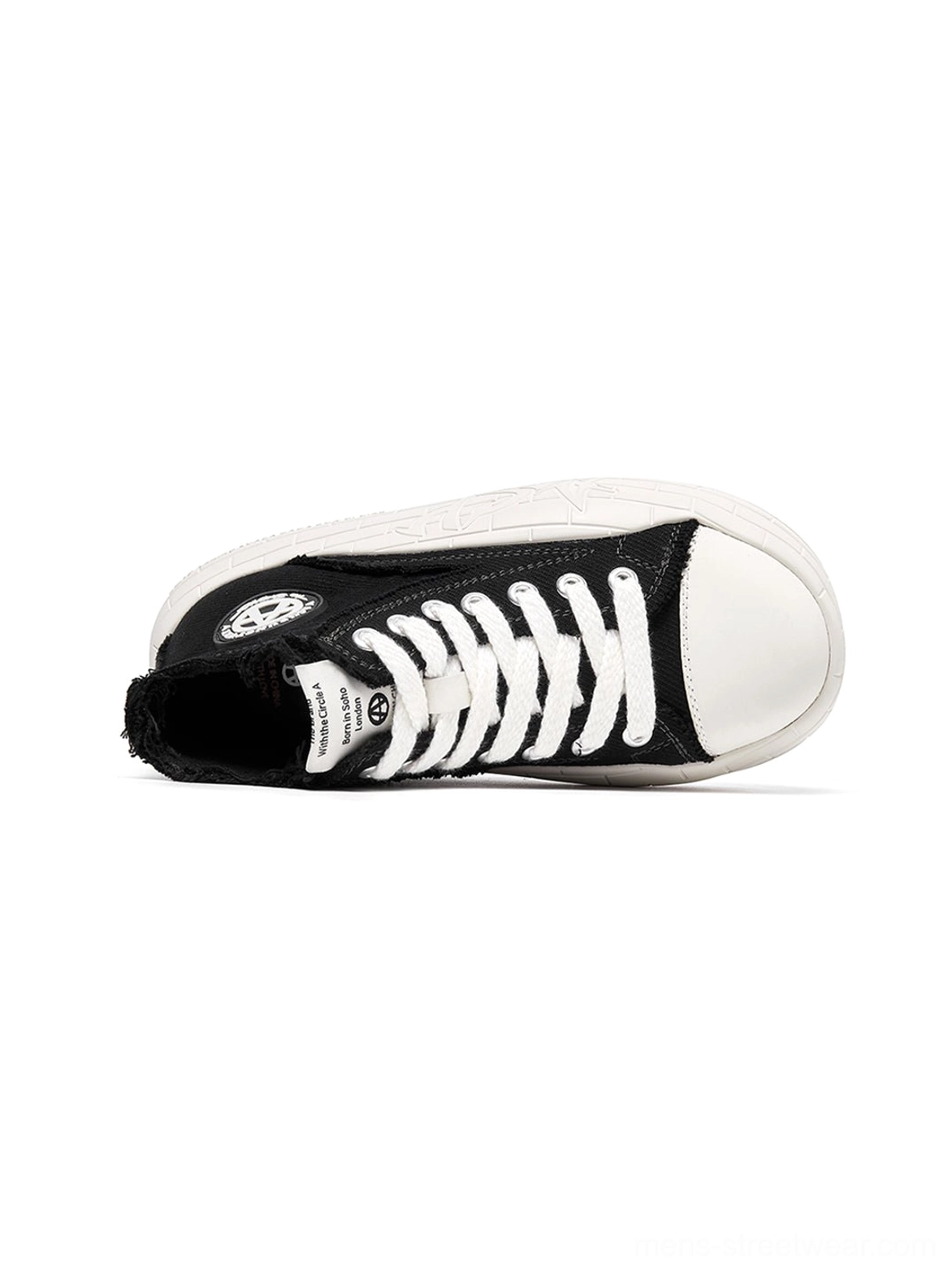 Two-tone platform high-top sneakers combining casual canvas construction with a statement streetwear shape