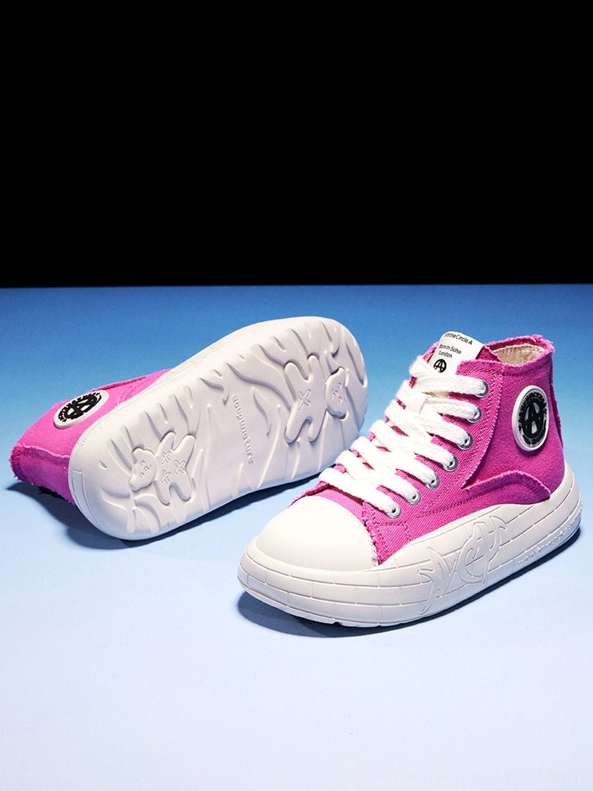 Black and red color options for two-tone canvas platform high-top sneakers with lace-up styling
