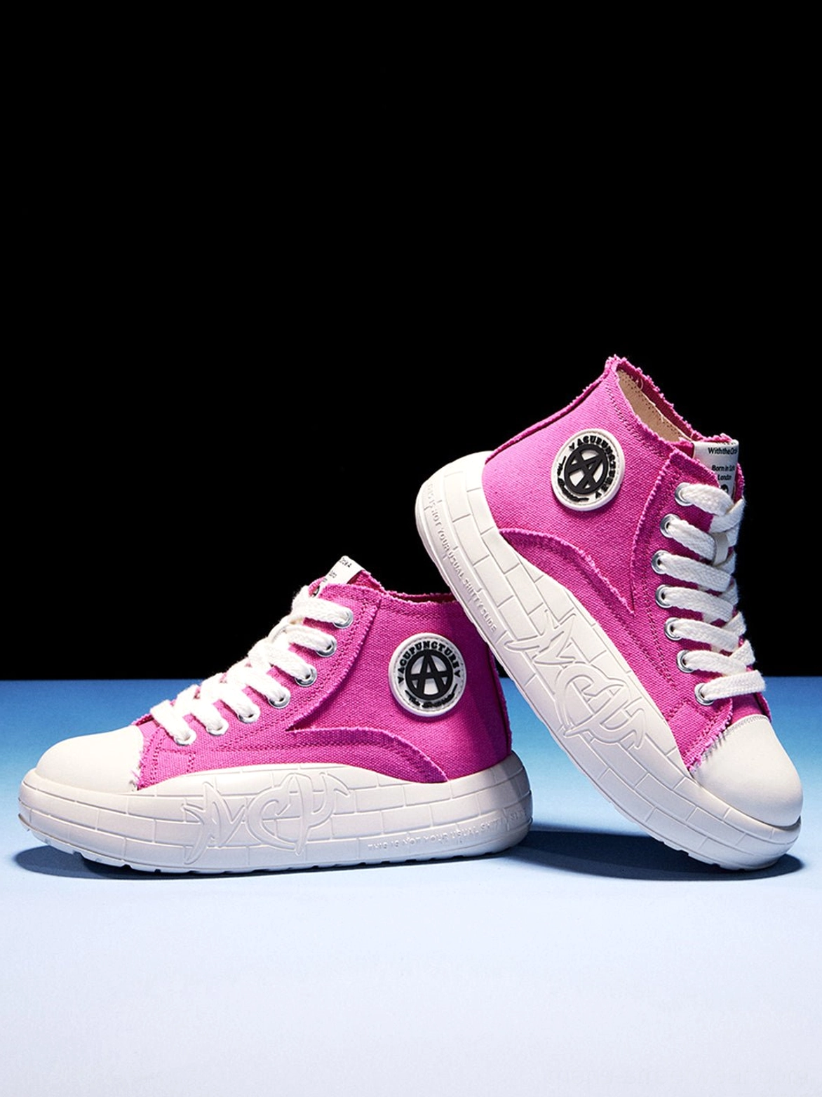 High-top canvas platform sneakers with contrast color blocking and an ankle-high streetwear silhouette