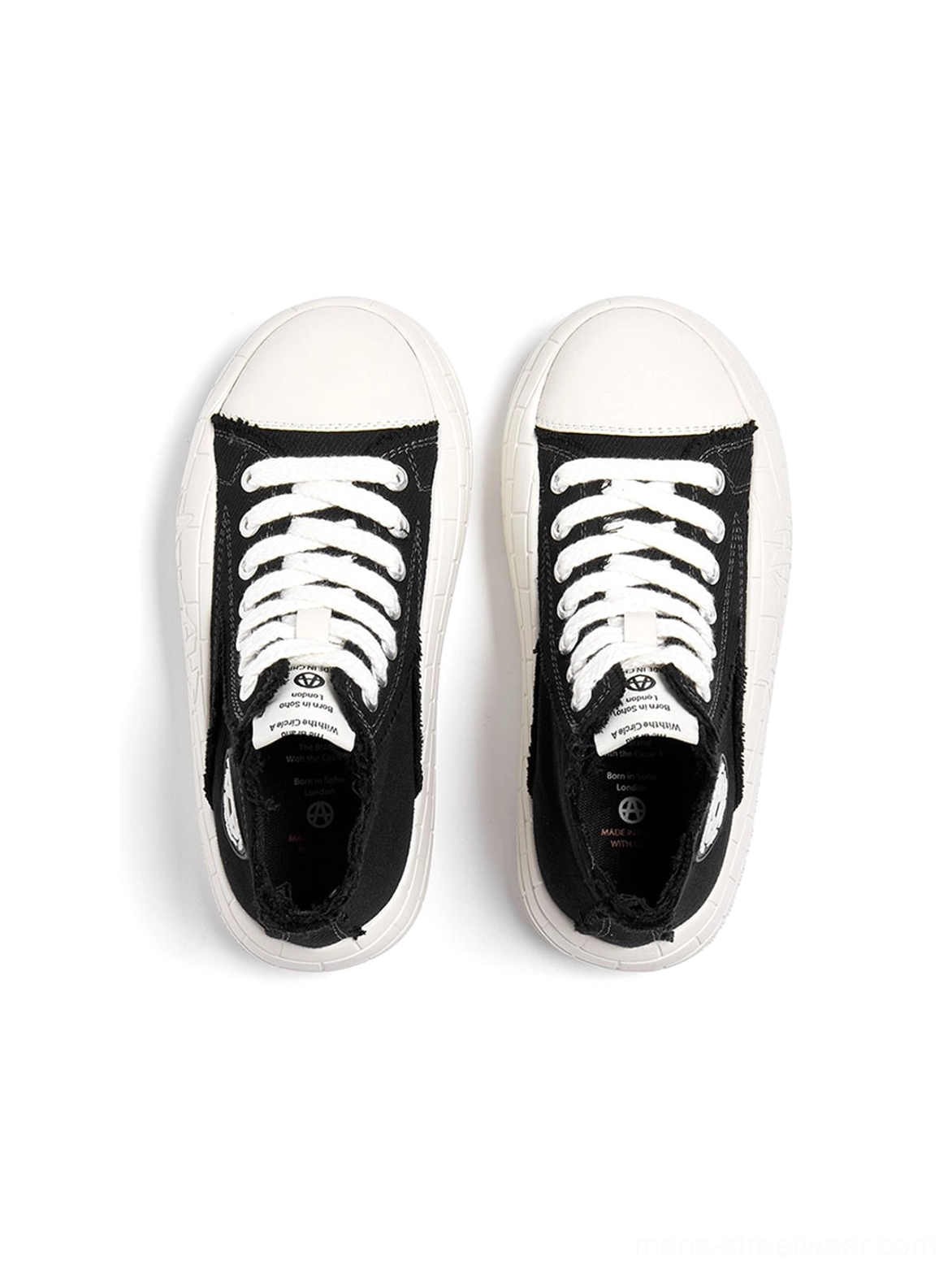 Platform canvas high-top sneakers in a graphic two-tone colorway with lace-up front and ankle-height profile