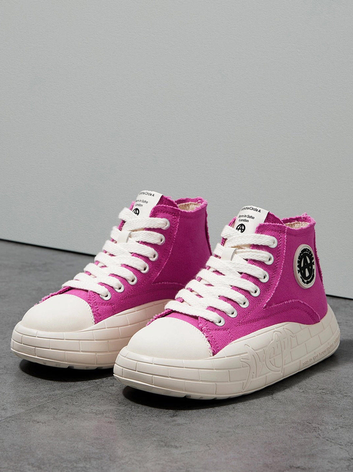Lace-up two-tone high-top sneakers in canvas with a lifted platform silhouette and casual streetwear appeal