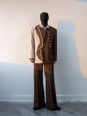 Front view of a structured two-tone shell button split blazer and matching wide-leg trouser suit in dark brown and cream