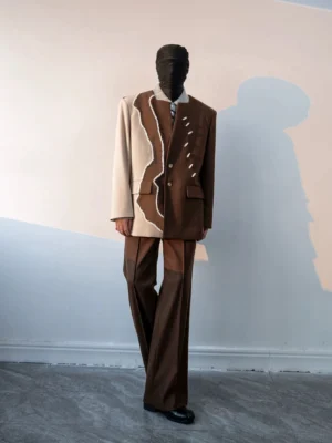 Two-tone dark brown and cream split blazer with wavy textured trim styled with matching wide-leg trousers in Korean avant-garde streetwear fashion