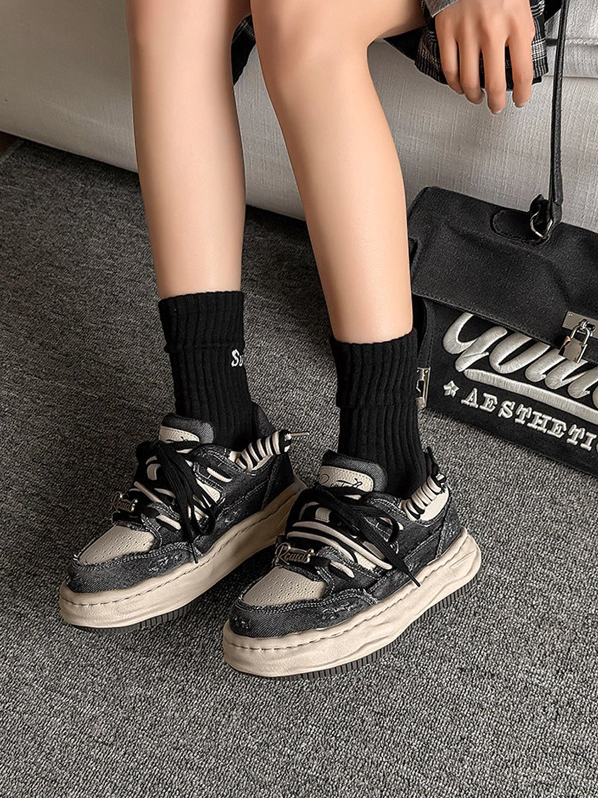 Two-tone vintage denim platform sneakers with layered laces and thick sole inspired by retro skate and street culture