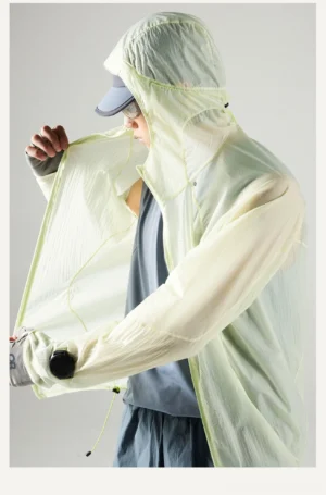 Side front view of the lightweight Lemon Green water-repellent sun protection jacket showing the open zipper and adjustable hem drawcord