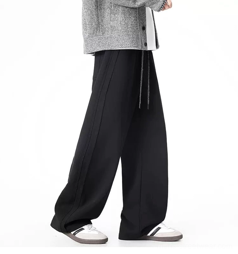 Black ultra-wide sweatpants side view showing long loose wide-leg Korean fashion silhouette