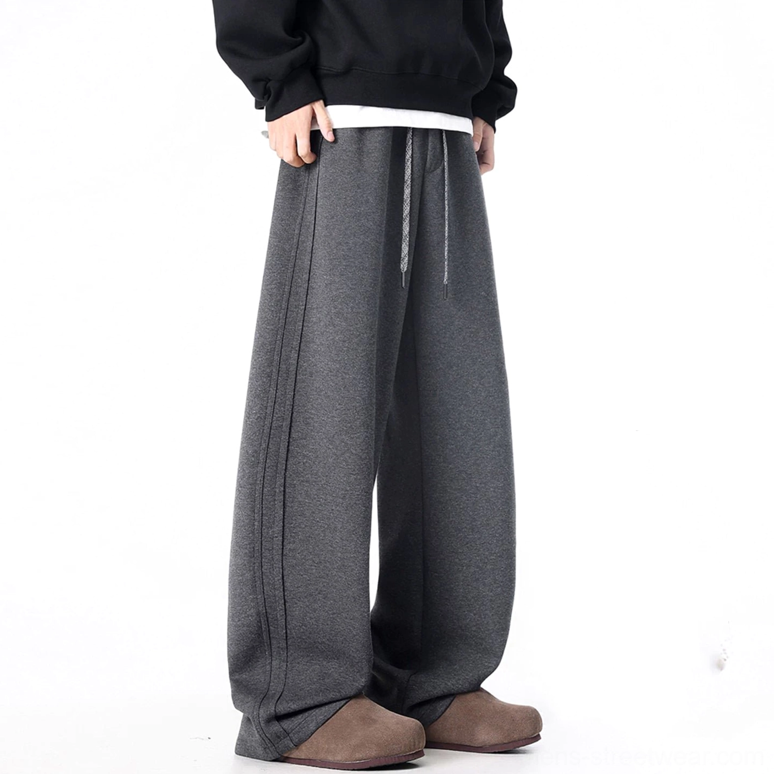 Dark gray ultra-wide drawstring sweatpants with soft draped baggy fit and minimalist styling