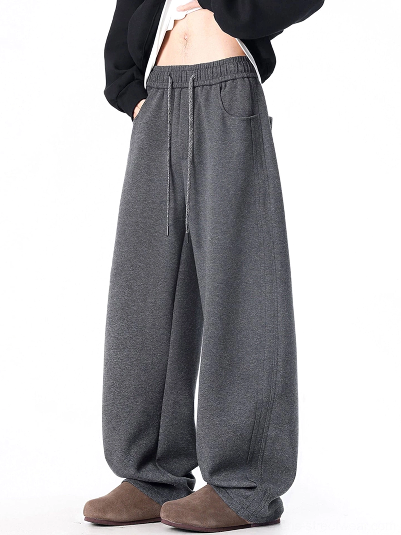 Dark gray ultra-wide sweatpants close view showing elastic drawstring waist and soft knit fabric