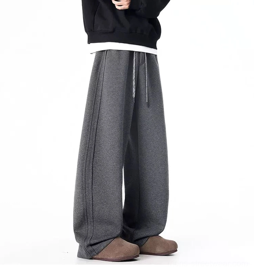 Dark gray floor-length wide-leg sweatpants with drawcord waist in minimalist Seoul fashion styling