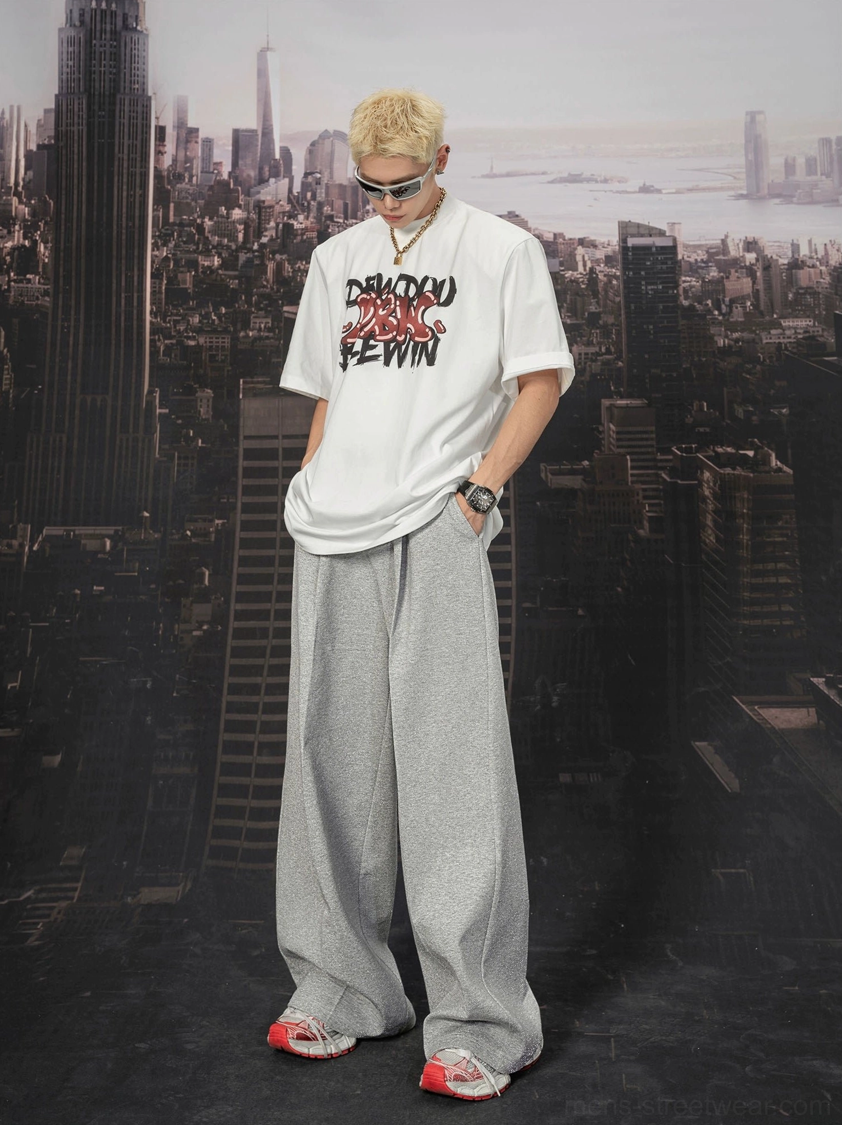 Front view of light grey ultra wide sweatpants styled with a graphic T-shirt in a modern Seoul streetwear outfit