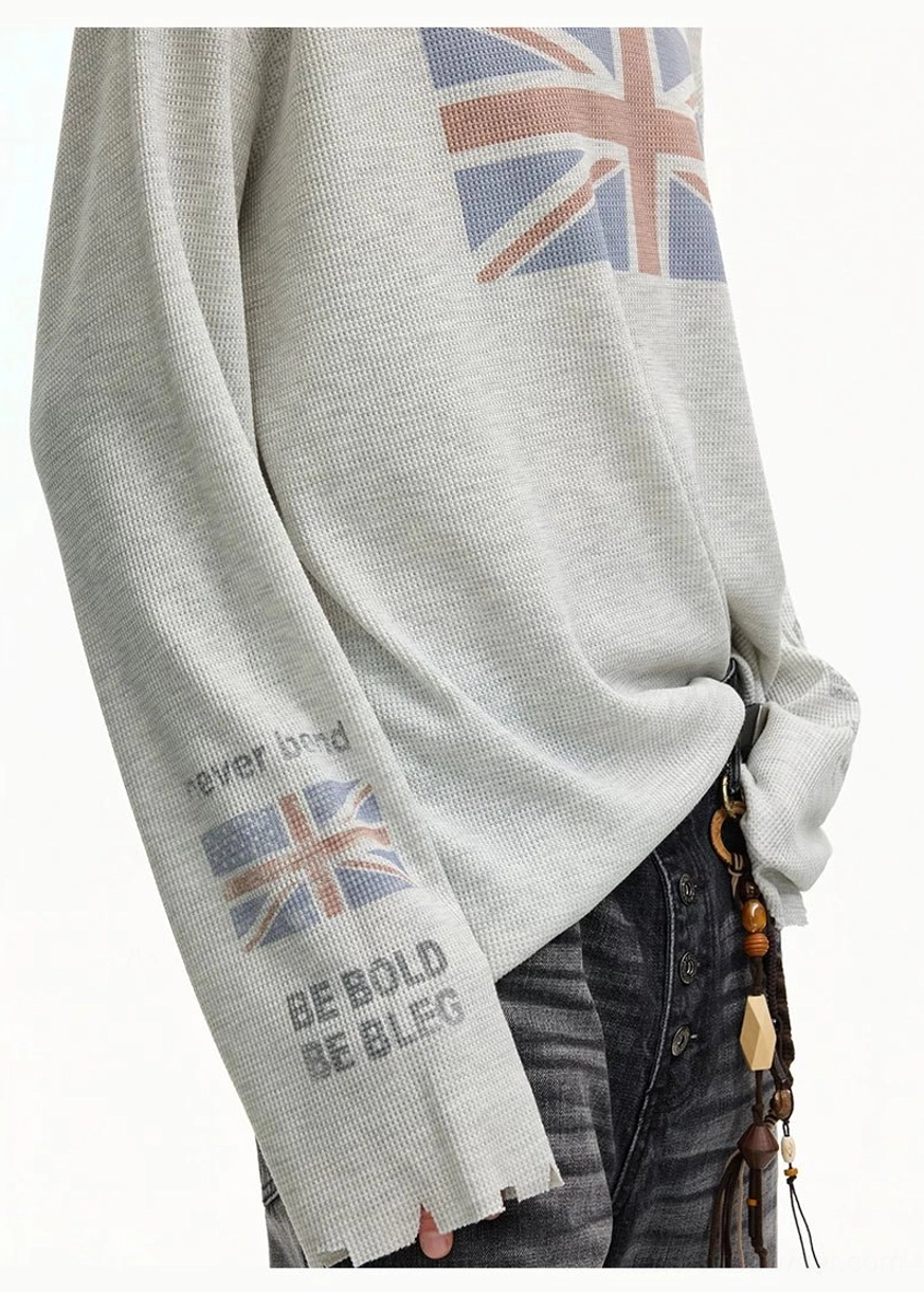 Close-up of gray Union Jack waffle knit streetwear tee with never bend and be bold sleeve slogan prints