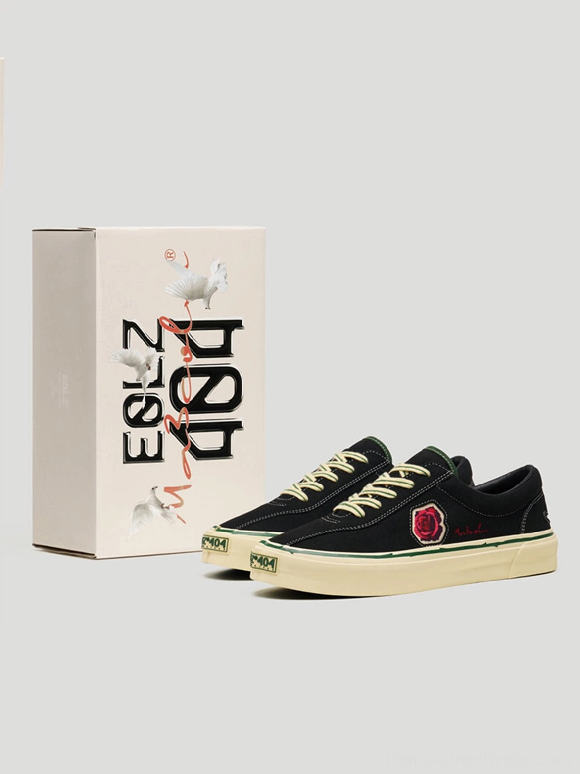 Unisex black rose embroidered skate shoes with low-top silhouette and contrasting vintage rubber outsole