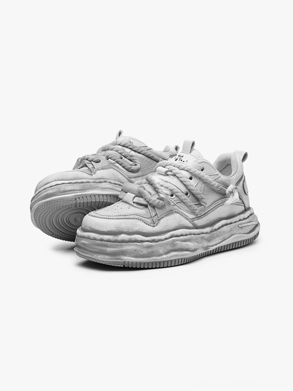Unisex distressed gray platform sneakers with a textured upper and statement wave-patterned midsole