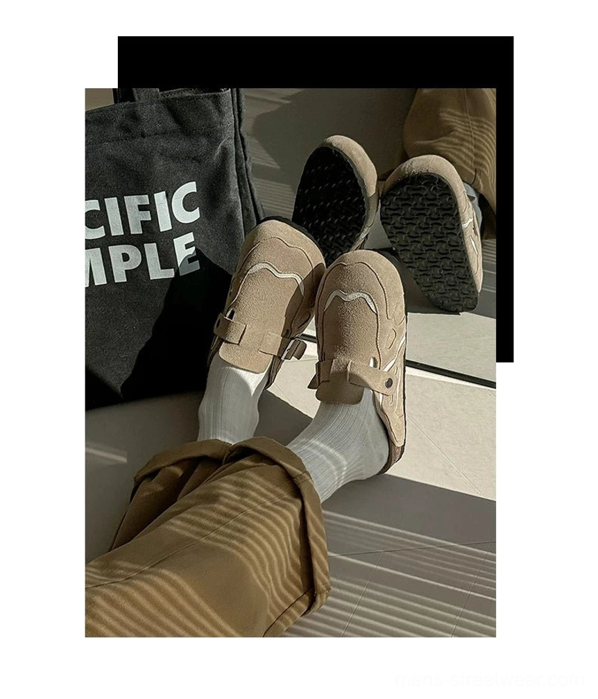 Modern unisex suede buckle clogs with open-back mule construction and relaxed Acubi-inspired streetwear proportions