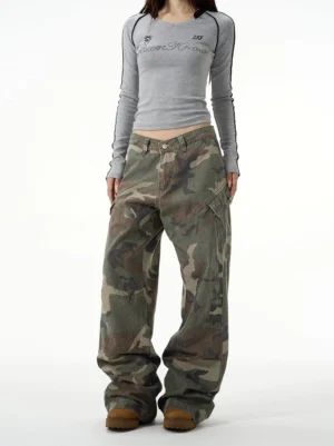 Unisex vintage camouflage baggy wide-leg cargo pants front view styled with grey long sleeve top and tan work boots