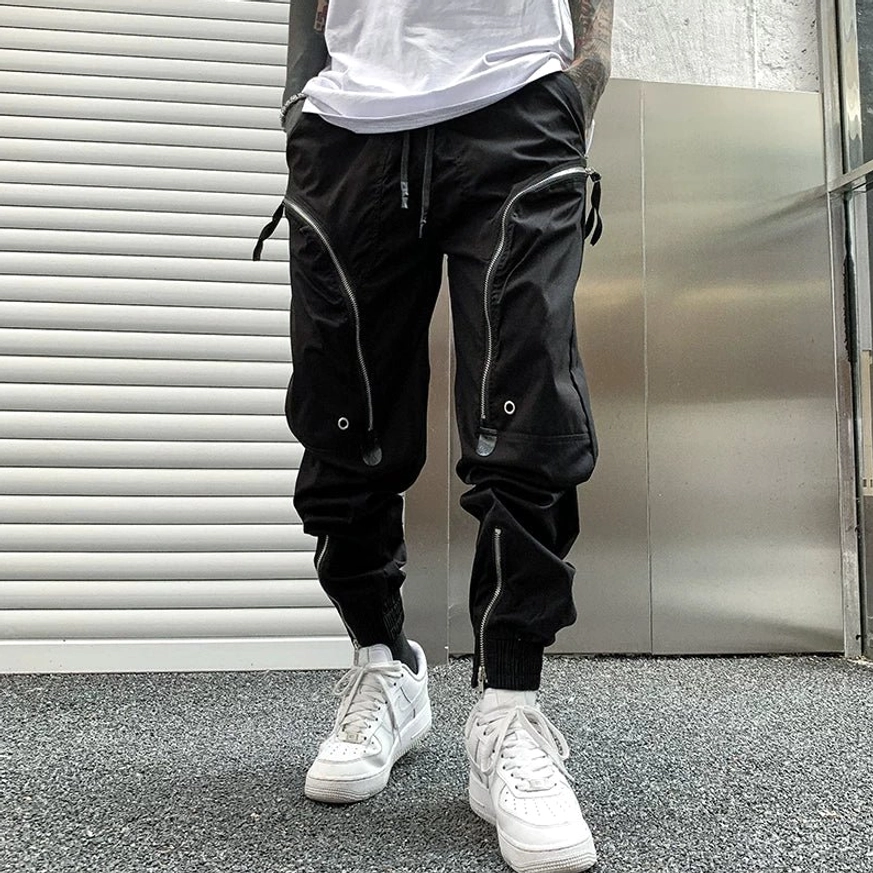 Urban streetwear tech cargo joggers featuring curved zipper lines, flap pockets and functional utility details