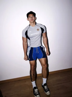 Front view of a men's gray color-block varsity performance jersey tee with contrast panels and athletic streetwear fit