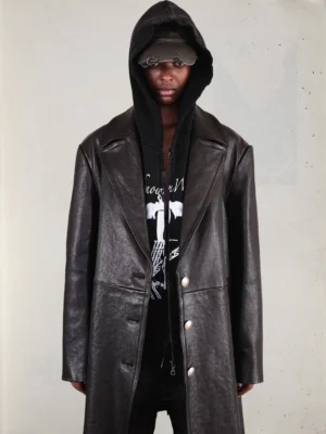 Black vegetable-tanned horsehide leather overcoat styled with hooded streetwear layers and flat cap