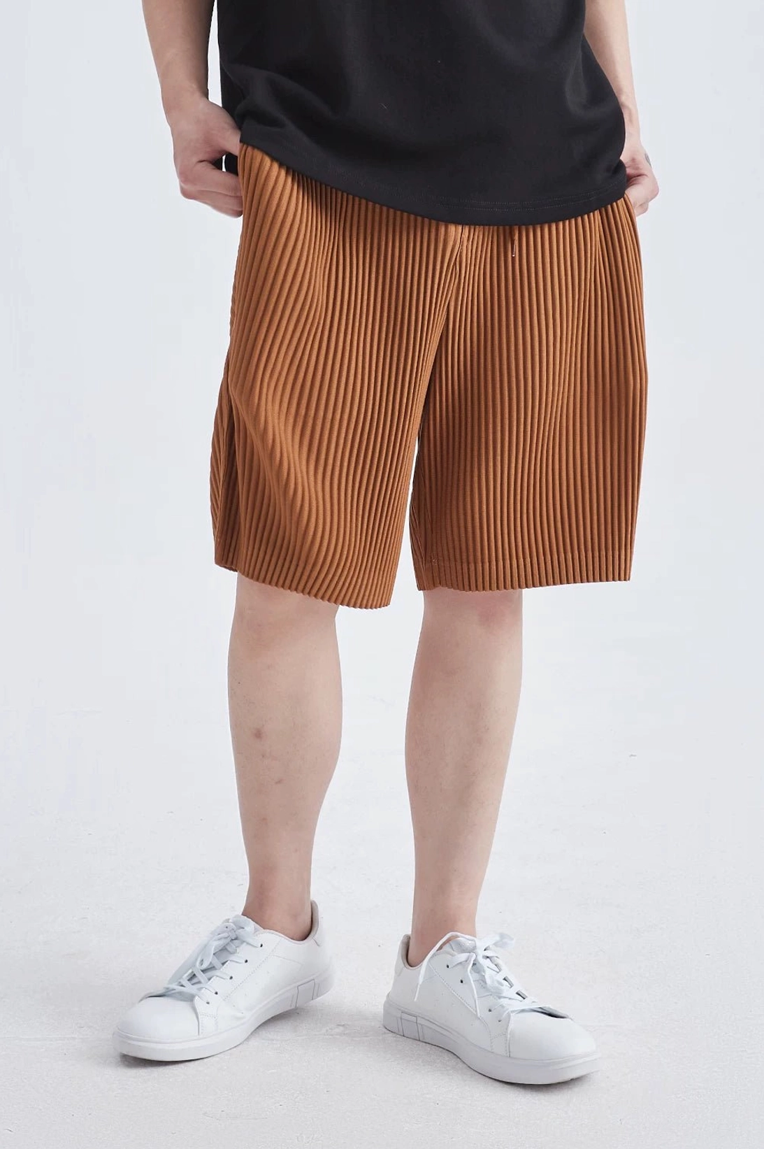 Architectural vertical pleated tech shorts with fluid drape for Seoul-inspired summer outfits
