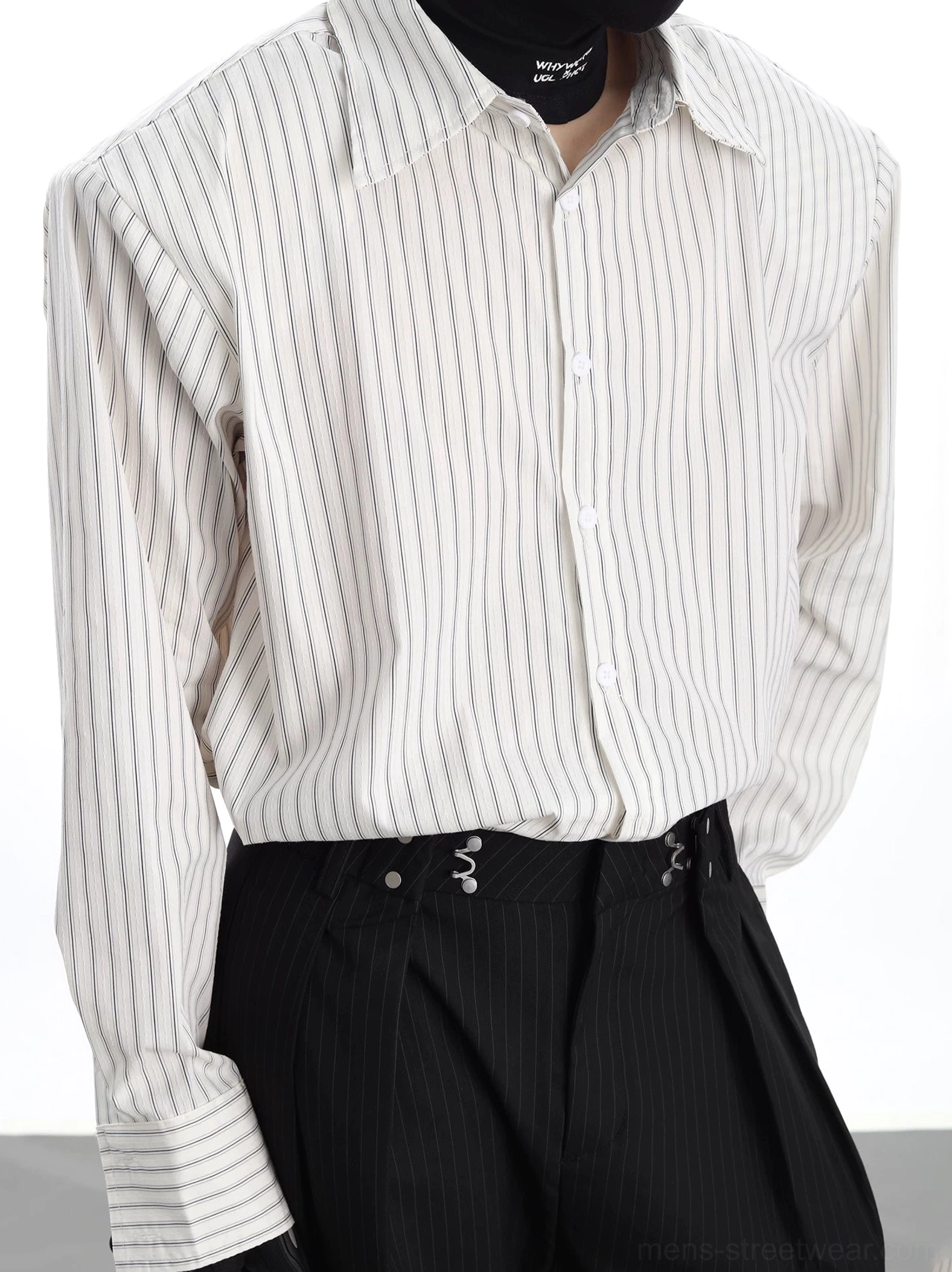 Close-up detail of the vertical stripe Oxford shirt showing pointed collar striped cuffs tailored shoulder seams and button placket