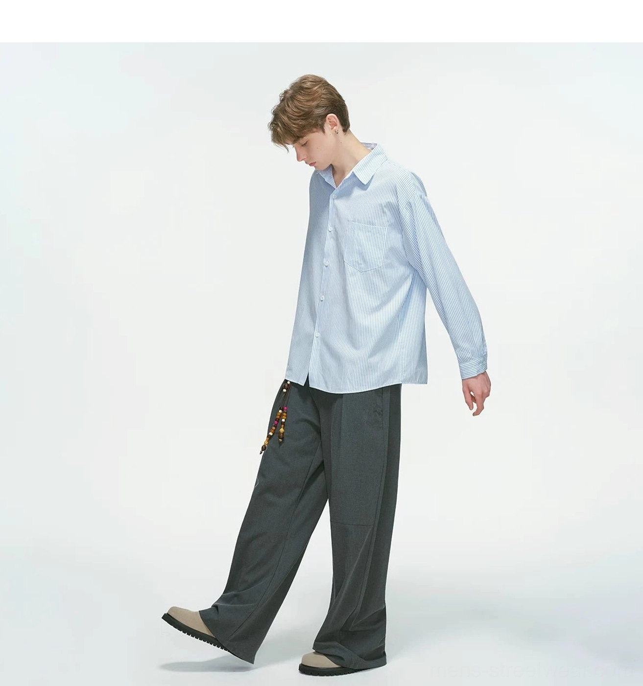 Vertical stripe relaxed Korean streetwear overshirt product styling with oversized proportions and casual layered outfit details